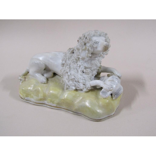 141 - A pair of 19c Staffordshire poodles, each with a bird, painted yellow bases, 7cm h.