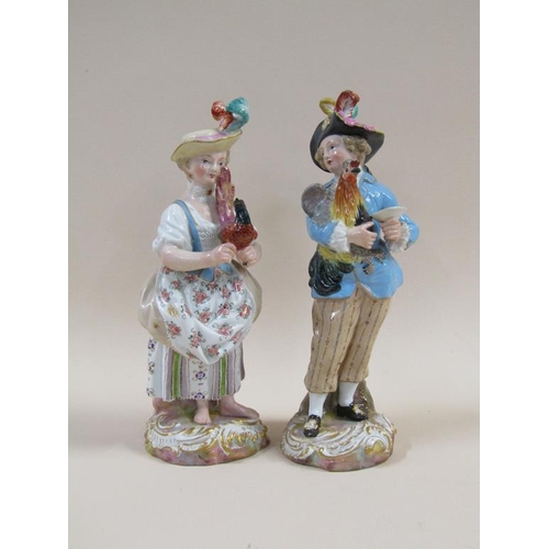 143 - A pair of 19c Meissen porcelain figures of a man and a lady, man holding a cockerel, lady holding a ... 