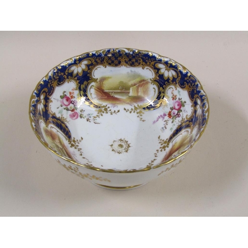 145 - An early 19c Rockingham style part tea service with hand painted panels of various landscapes and bu... 