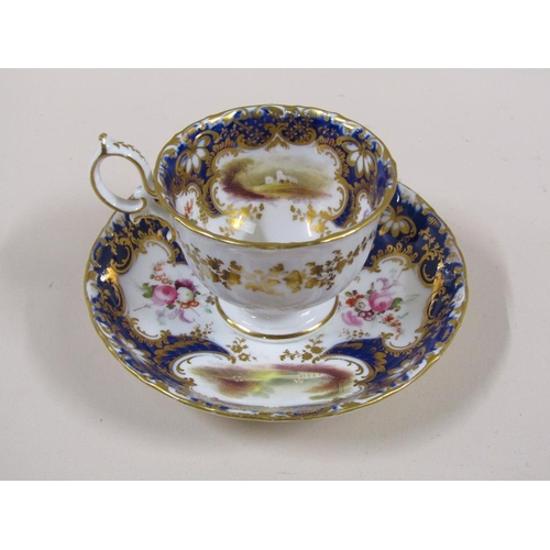 145 - An early 19c Rockingham style part tea service with hand painted panels of various landscapes and bu... 