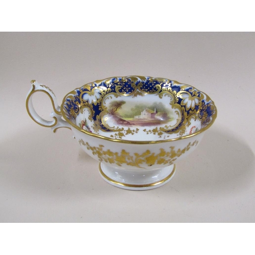 145 - An early 19c Rockingham style part tea service with hand painted panels of various landscapes and bu... 