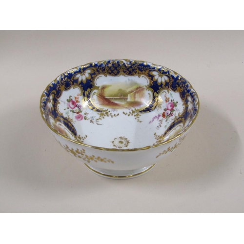 145 - An early 19c Rockingham style part tea service with hand painted panels of various landscapes and bu... 