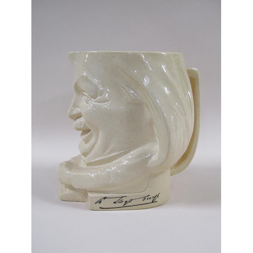 151 - A 1920's Ashstead pottery character jug by Percy Metcalfe depicting Lloyd George, 19cm h.