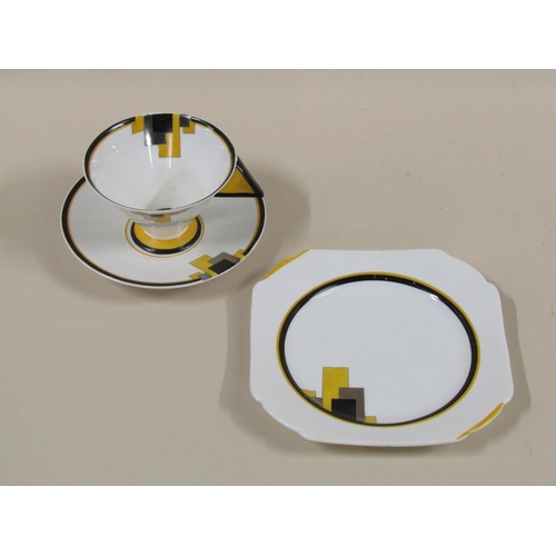 153 - Three Art Deco Shelley Vogue yellow block tea trios, pattern 11787, comprising three cups, 7cm h, th... 