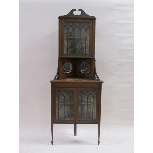 254 - A late Victorian/Edwardian mahogany standing corner cupboard, the upper glazed cabinet with broken a... 