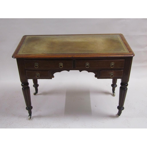 260 - A Victorian mahogany writing table of rectangular form with a tooled leather insert, fitted two long... 