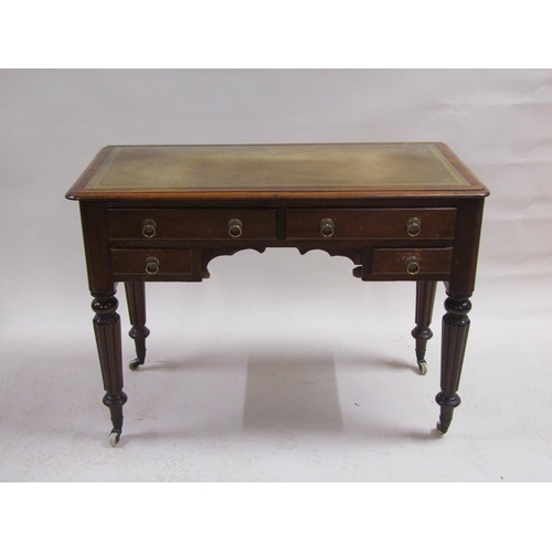 260 - A Victorian mahogany writing table of rectangular form with a tooled leather insert, fitted two long... 