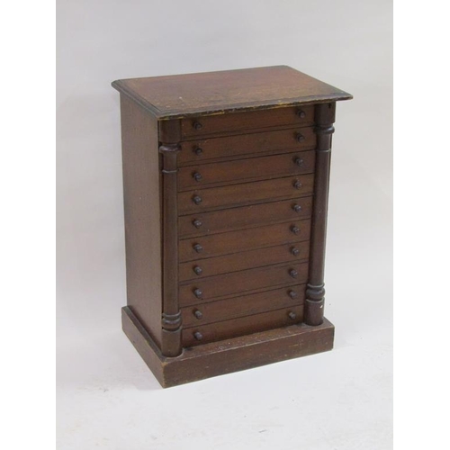 266 - A 19c mahogany collectors cabinet of ten long drawers and split column locking bars, containing a co... 