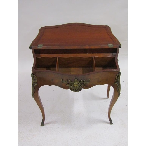 268 - A 19c walnut fold over card table of serpentine form with ormolu mounts and supported on cabriole le... 