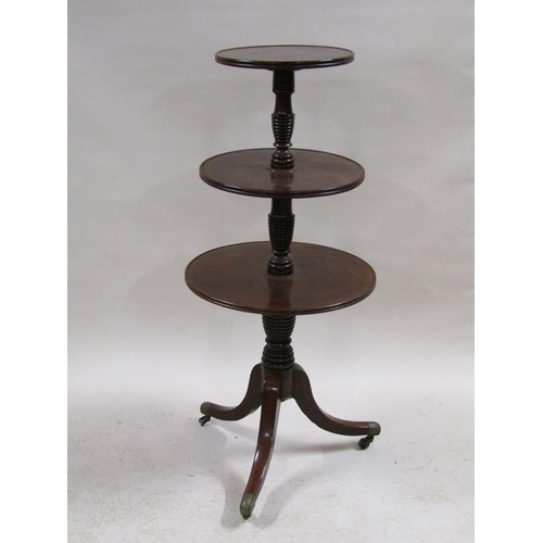 273 - A late Georgian mahogany three tier revolving dumb waiter supported on a short ring turned column an... 