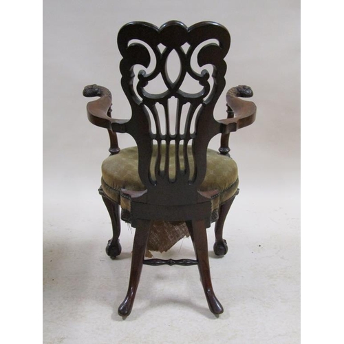 277 - An early 19c American mahogany open armchair with pierced and carved scrolling back panel, curved ar... 