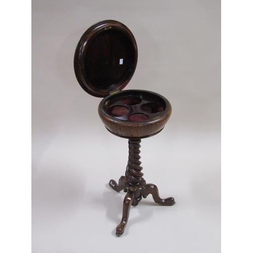 283 - A Victorian rosewood teapoy with a circular box, lift up cover and fitted with four compartments and... 