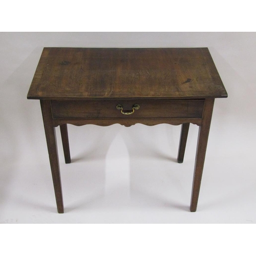 286 - A Georgian mahogany side table of rectangular form, with one long frieze drawer supported on square ... 