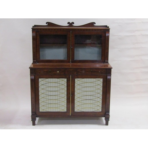 289 - An early 19c figure mahogany chiffonier, the base enclosed by two doors with material and brass latt... 