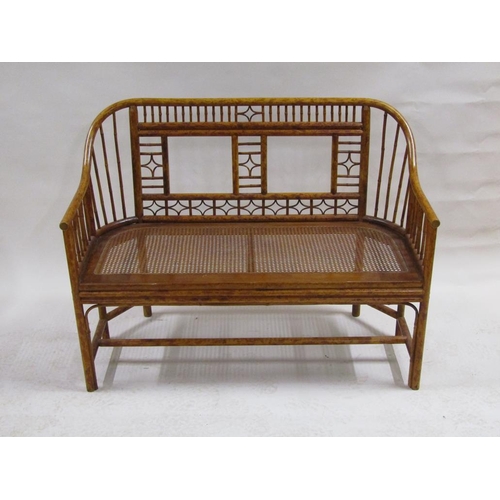 303 - An early 19c Brighton Pavilion style bamboo two seater sofa with cane seat, 116cm w, 88cm h.