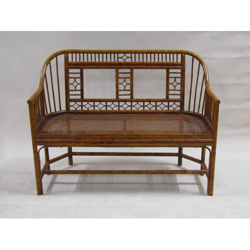 303 - An early 19c Brighton Pavilion style bamboo two seater sofa with cane seat, 116cm w, 88cm h.