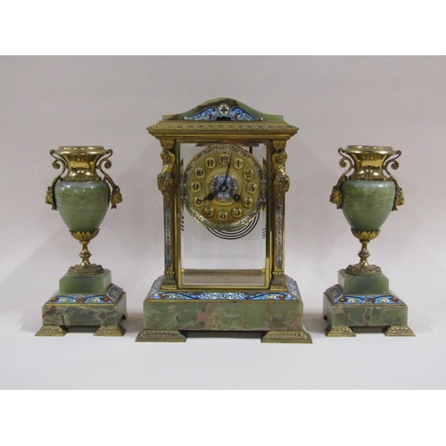 4 - A late 19c French garniture de cheminée comprising a four glass mantel clock and two side urns.  The... 