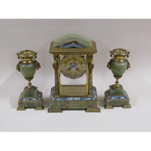 4 - A late 19c French garniture de cheminée comprising a four glass mantel clock and two side urns.  The... 