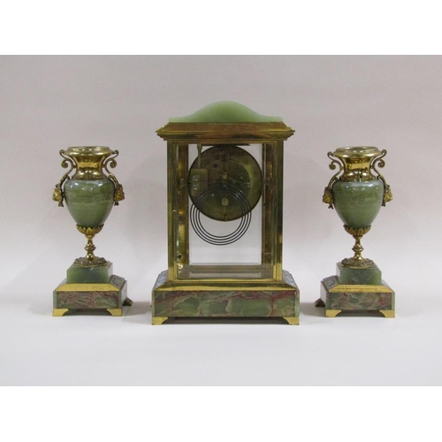 4 - A late 19c French garniture de cheminée comprising a four glass mantel clock and two side urns.  The... 