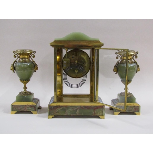 4 - A late 19c French garniture de cheminée comprising a four glass mantel clock and two side urns.  The... 