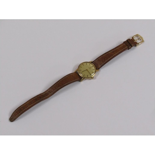 52 - A ladies Omega wristwatch with gold case movement and brown leather strap.