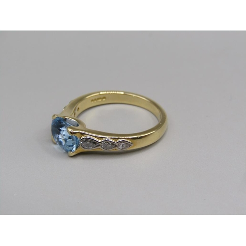 57 - An 18ct gold aquamarine and diamond set ring, size N.