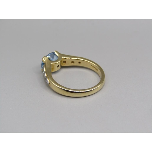 57 - An 18ct gold aquamarine and diamond set ring, size N.