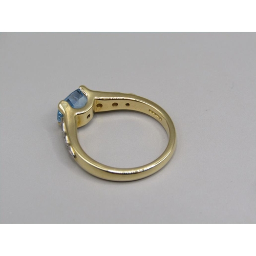 57 - An 18ct gold aquamarine and diamond set ring, size N.