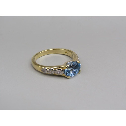 57 - An 18ct gold aquamarine and diamond set ring, size N.