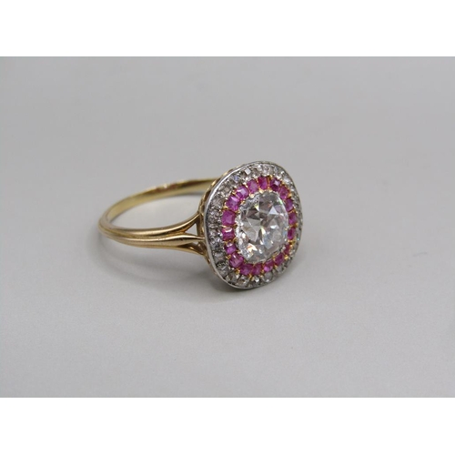 59 - A gold diamond and ruby set ring, the principal stone approx. 1.25carats, size O.