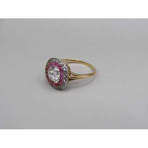 59 - A gold diamond and ruby set ring, the principal stone approx. 1.25carats, size O.