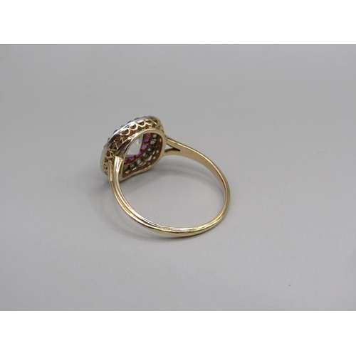 59 - A gold diamond and ruby set ring, the principal stone approx. 1.25carats, size O.