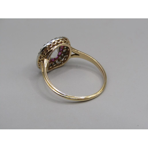 59 - A gold diamond and ruby set ring, the principal stone approx. 1.25carats, size O.