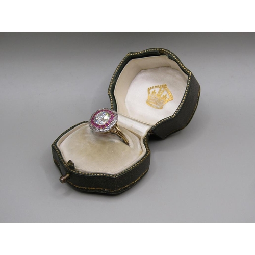 59 - A gold diamond and ruby set ring, the principal stone approx. 1.25carats, size O.