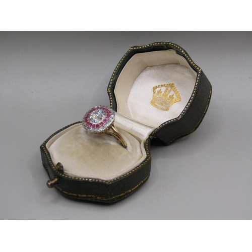 59 - A gold diamond and ruby set ring, the principal stone approx. 1.25carats, size O.