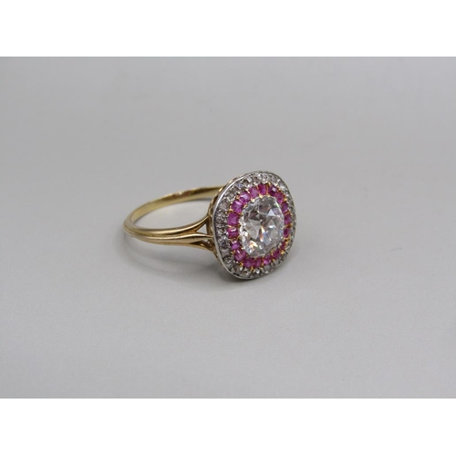 59 - A gold diamond and ruby set ring, the principal stone approx. 1.25carats, size O.