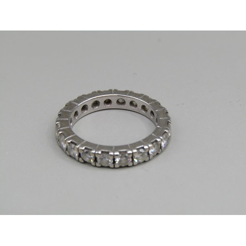 60 - A platinum diamond set eternity ring, set with twenty cut diamonds, size K 1/2.