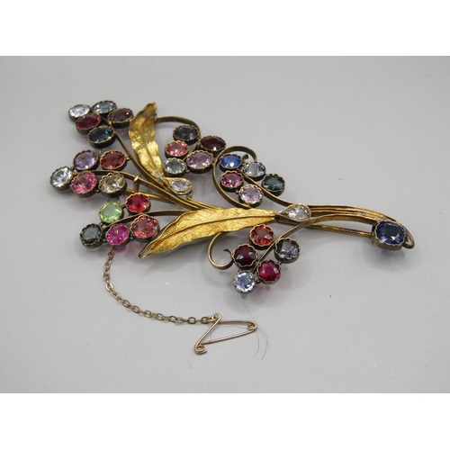 61 - An early 20c Continental gold multi stone set floral spray brooch, leaf stems mounted with teardrop ... 