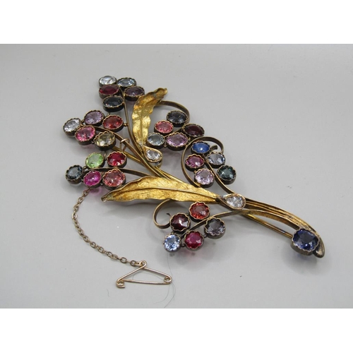 61 - An early 20c Continental gold multi stone set floral spray brooch, leaf stems mounted with teardrop ... 