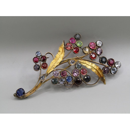 61 - An early 20c Continental gold multi stone set floral spray brooch, leaf stems mounted with teardrop ... 