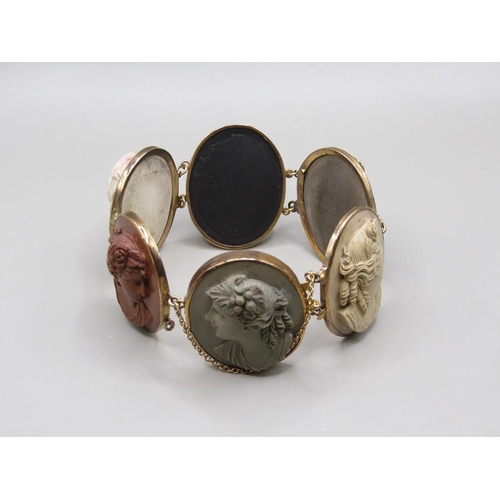 63 - A late 19c/early 20c gold coloured lava cameo bracelet, having six oval cameos of classical female h... 