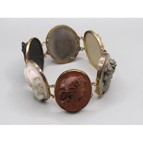 63 - A late 19c/early 20c gold coloured lava cameo bracelet, having six oval cameos of classical female h... 