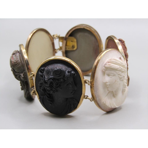 63 - A late 19c/early 20c gold coloured lava cameo bracelet, having six oval cameos of classical female h... 