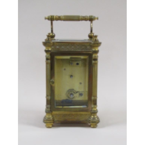 7 - A late 19c French carriage clock in decorated columned brass case, the white rectangular enamel dial... 