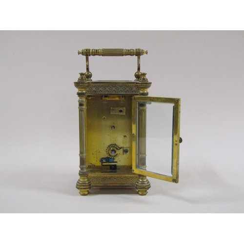 7 - A late 19c French carriage clock in decorated columned brass case, the white rectangular enamel dial... 