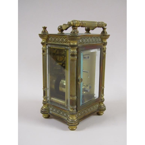 7 - A late 19c French carriage clock in decorated columned brass case, the white rectangular enamel dial... 