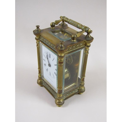 7 - A late 19c French carriage clock in decorated columned brass case, the white rectangular enamel dial... 