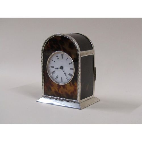 8 - An early 20c French carriage clock in 'hump back' silver case with tortoiseshell panels to front sid... 