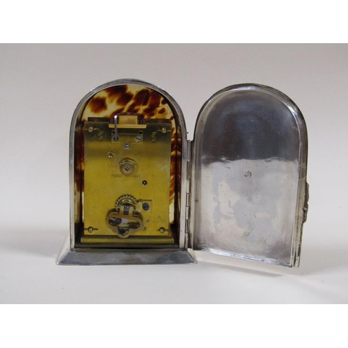 8 - An early 20c French carriage clock in 'hump back' silver case with tortoiseshell panels to front sid... 