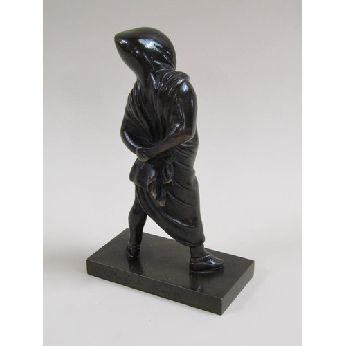 23 - A late 19c/early 20c patinated bronze figure of a young girl with hood and cloak, 17cm h.